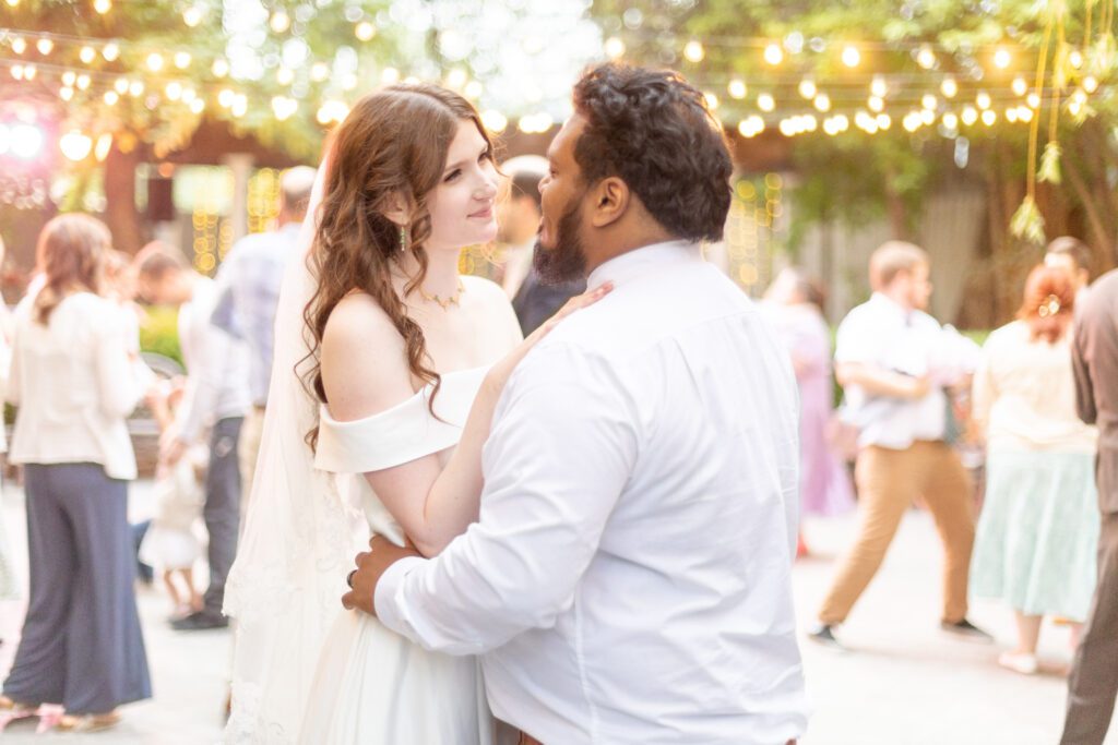 A bride and groom dance to their special song.