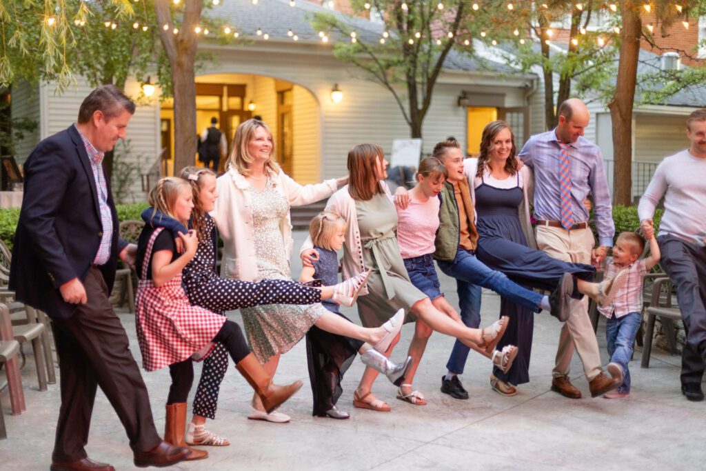 Extended family celebrate together at a wedding reception in Bountiful, UT